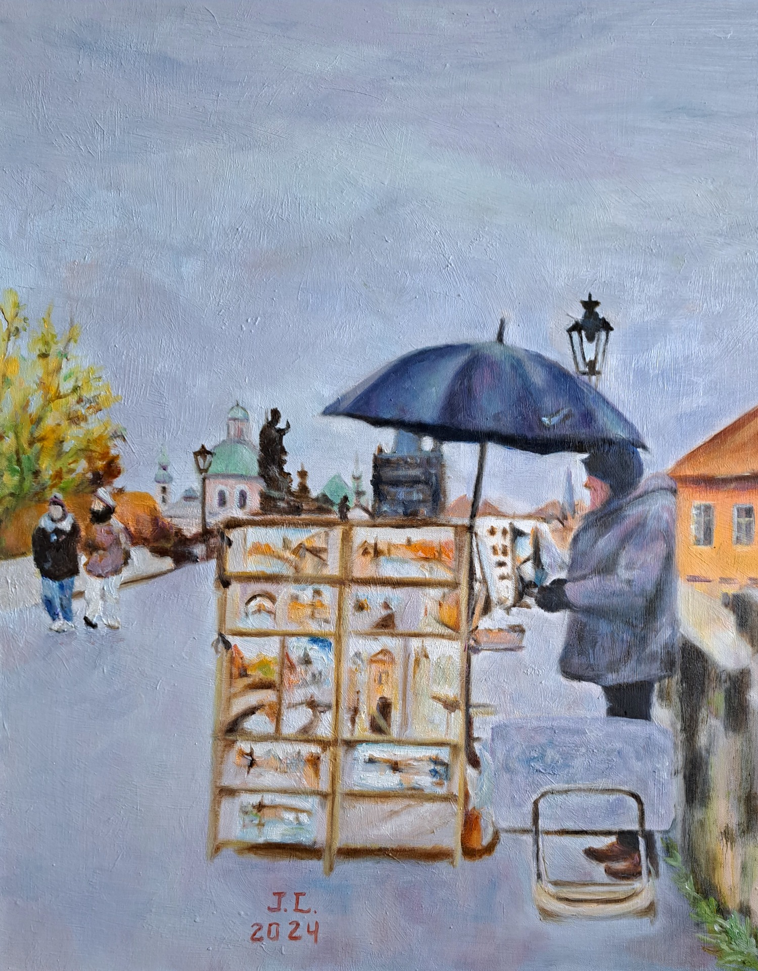 Painter on the Charles Bridge in Prague. 